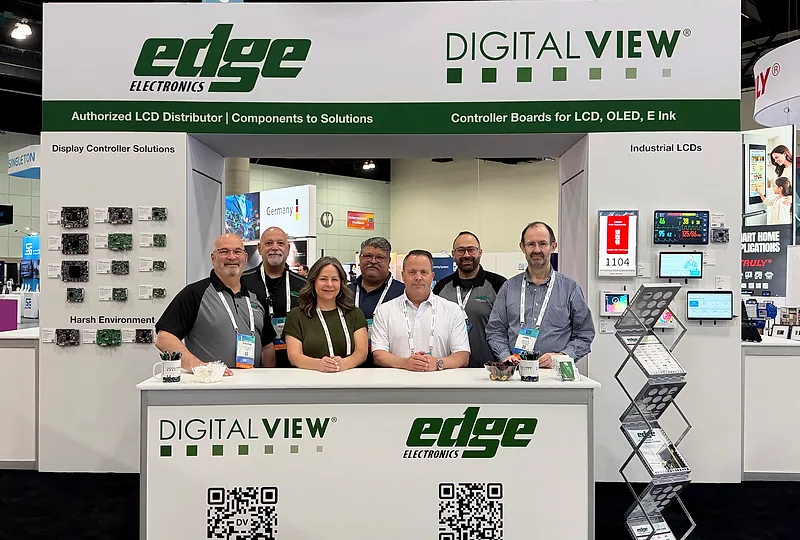 Edge Electronics and Digital View team members together at their shared booth, with both companies’ signs above controller boards and display demonstrations